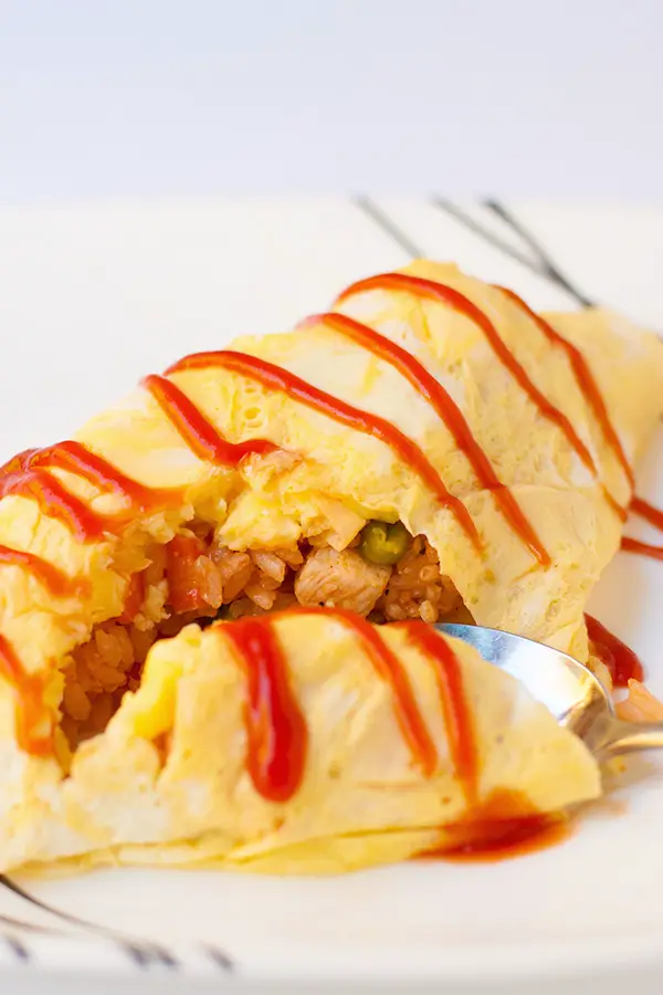 Cheater's Japanese Omelette Rice- Known in Japan as Omurice. You don't need chef skills to make a beautiful Japanese omelette rice with this trick. An easy meal that is loved by kids to adults.