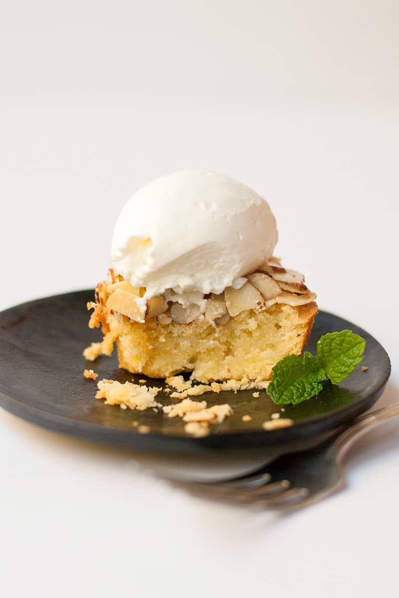 A cute almond tart made in a muffin tin. Tart crust, almond filling, and a glazed almond topping. Top with whipped cream for an elegant dessert.