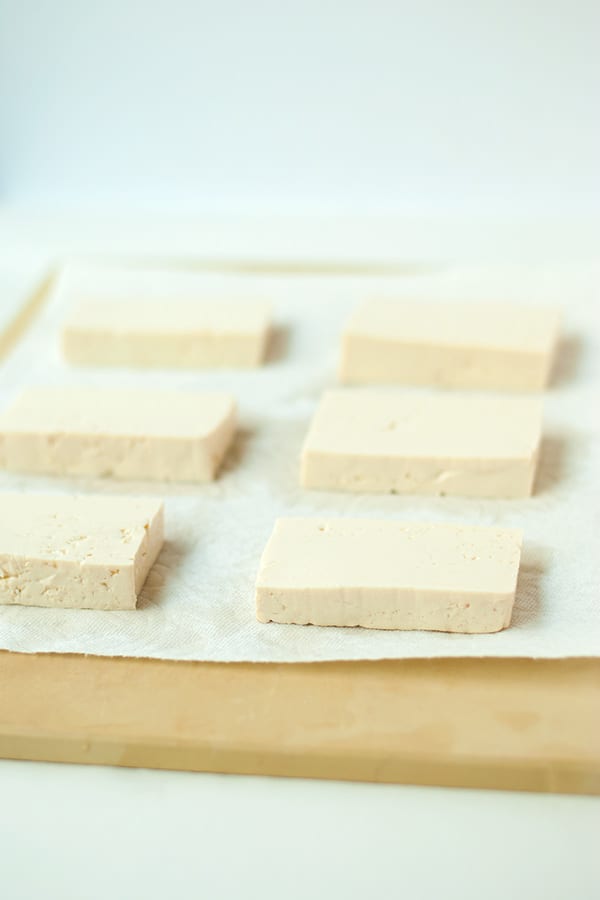 Cut tofu into slabs and drain water before pan frying.