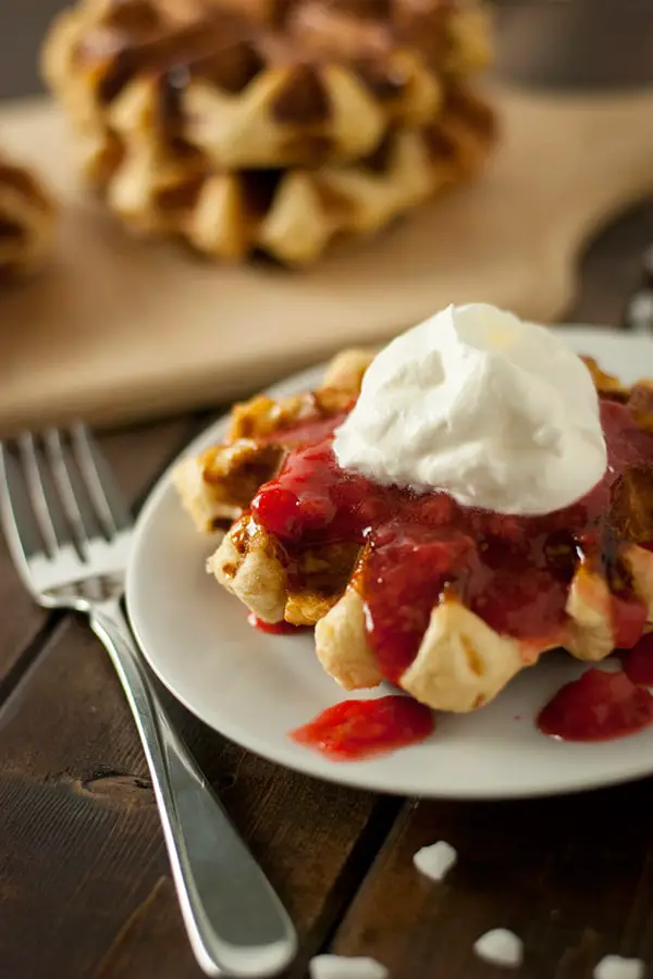 Belgian Liege Waffles with Whipped Cream and Strawberry compote.