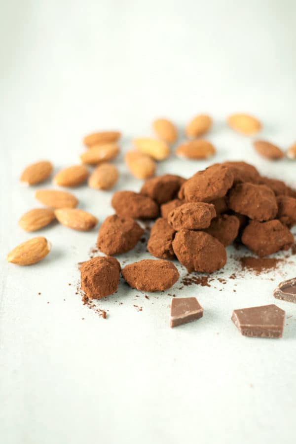 Chocolate covered caramel almonds- roasted almonds are covered with a crunchy caramelized shell, dipped in milk chocolate, and dusted with cocoa powder.