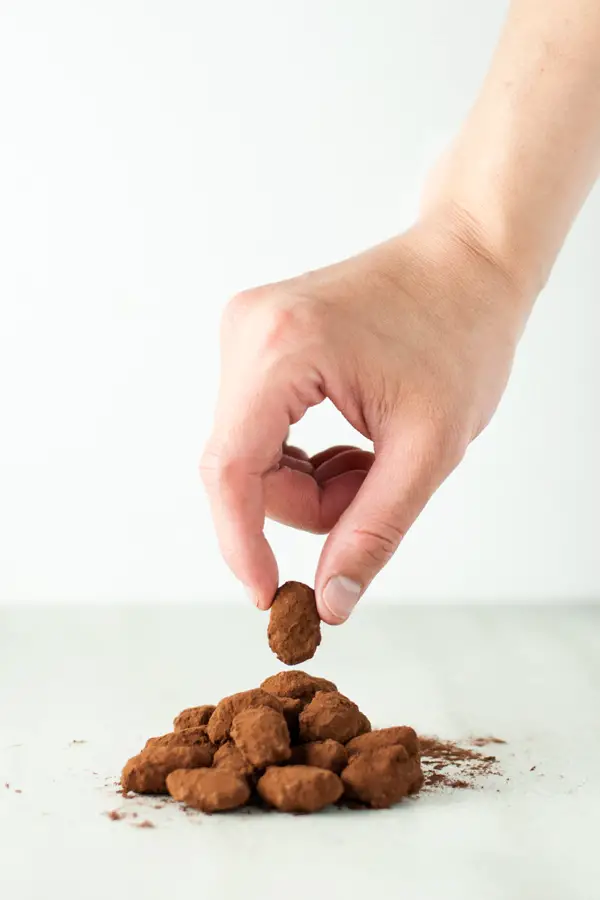 Chocolate covered caramel almonds- roasted almonds are covered with a crunchy caramelized shell, dipped in milk chocolate, and dusted with cocoa powder.