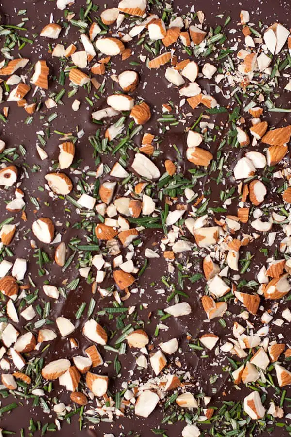 Rosemary Bark- This ultra thin dark chocolate rosemary bark is loaded with sea salt, roasted almond pieces, and chopped fresh rosemary.