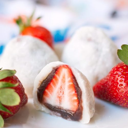 Strawbery Mochi (Daifuku)- a delicious Japanese mochi dessert. A whole strawberry is covered in a layer of red bean paste and wrapped in mochi.
