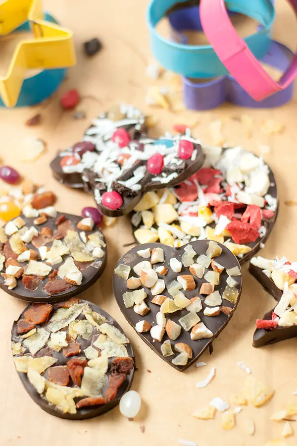 Cookie Cutter Chocolates- These cookie cutter chocolates are a great activity to do with kids! Melted chocolate is poured into cookie cutter molds and topped with all sorts of fun toppings!