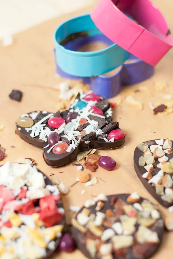 Cookie Cutter Chocolates- These cookie cutter chocolates are a great activity to do with kids! Melted chocolate is poured into cookie cutter molds and topped with all sorts of fun toppings!