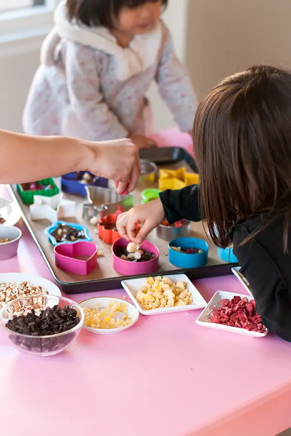 Cookie Cutter Chocolates- These cookie cutter chocolates are a great activity to do with kids! Melted chocolate is poured into cookie cutter molds and topped with all sorts of fun toppings!