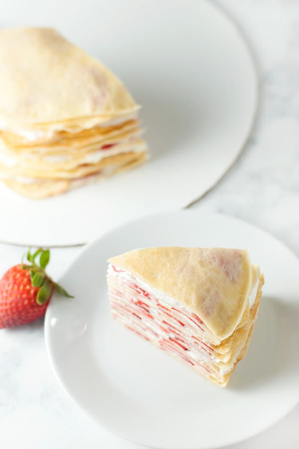 top view of sliced strawberry crepe cake.