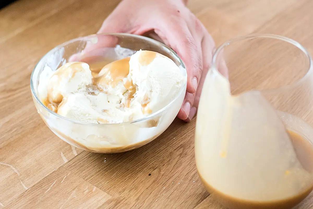 Bowl of vanilla ice cream topped with miso butterscotch.
