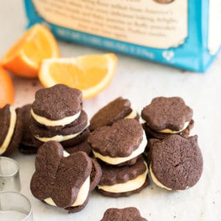 These adorable chocolate orange sandwich cookies have an intense chocolate flavor that pairs perfectly with the fresh orange buttercream.