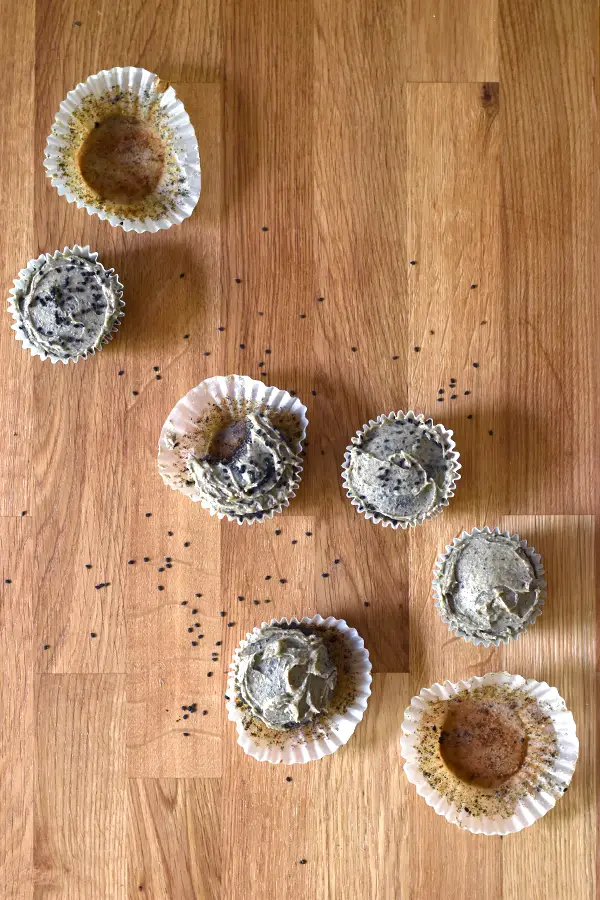 Top down view of cakes and empty liners. 