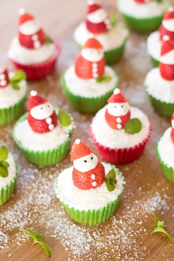 Lots of santa cupcakes lined up ready for your Christmas party!