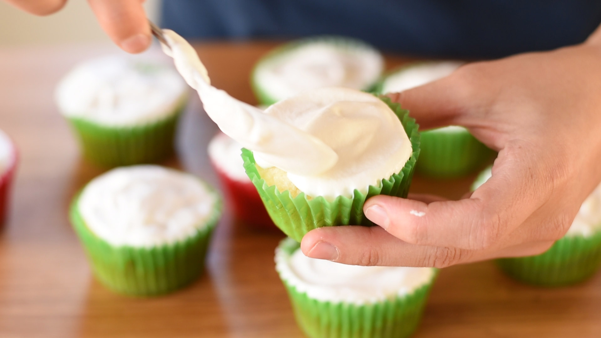 Frosting the cupcake with stabilized whipped cream.