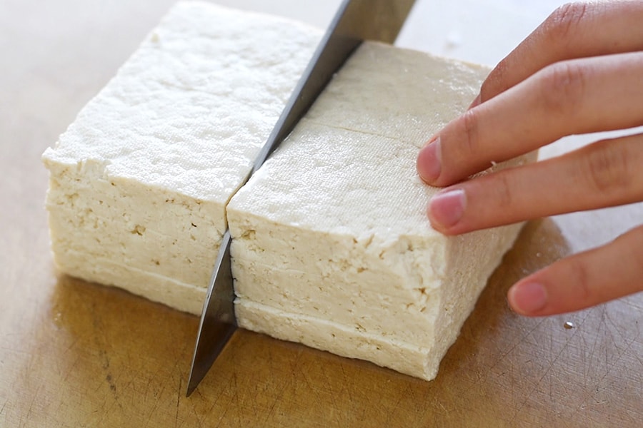 Cutting block of tofu into 12 pieces. 