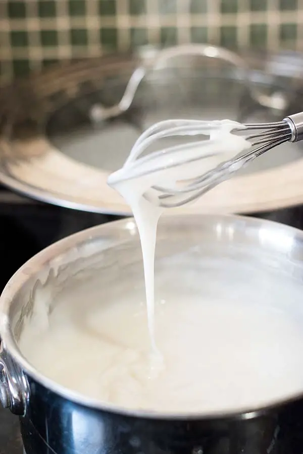 Cooking Hawaiian coconut pudding with four ingredients, coconut milk, sugar, corn starch and water.