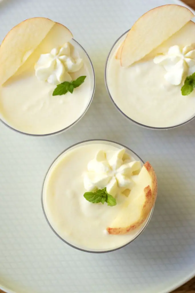 This fresh apple mousse is light, crisp, and refreshing. The chunks of apple add a nice texture, and the lack of spices lets the apple flavor really shine. Overhead shot of the apple mousse in cups.